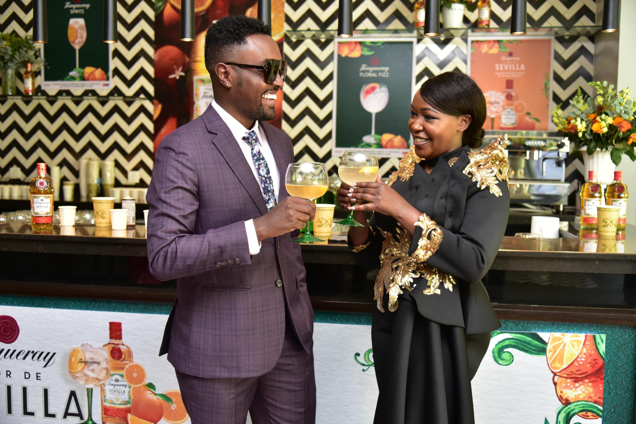 Terryanne chebet and male friend at Tanqueray Flor De Sevilla Gin event